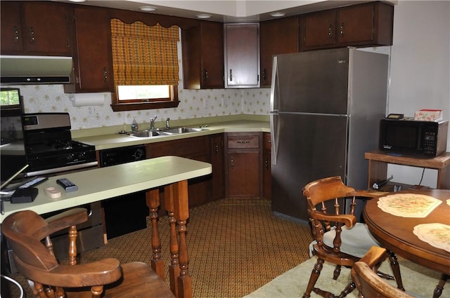 kitchen with sink, stainless steel fridge, ventilation hood, and dark brown cabinetry