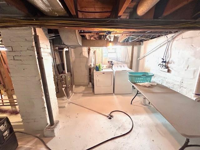 basement with washer and clothes dryer