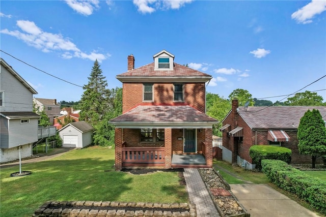 view of front of house with a garage, an outdoor structure, covered porch, and a front yard