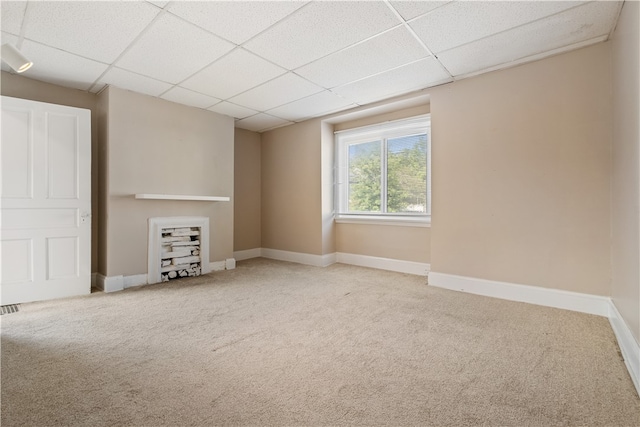 interior space with a paneled ceiling