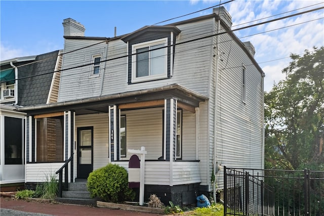 multi unit property featuring cooling unit and covered porch