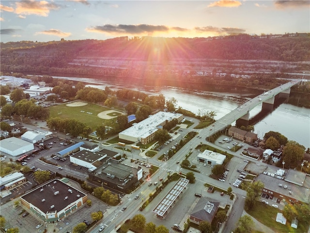 aerial view at dusk with a water view