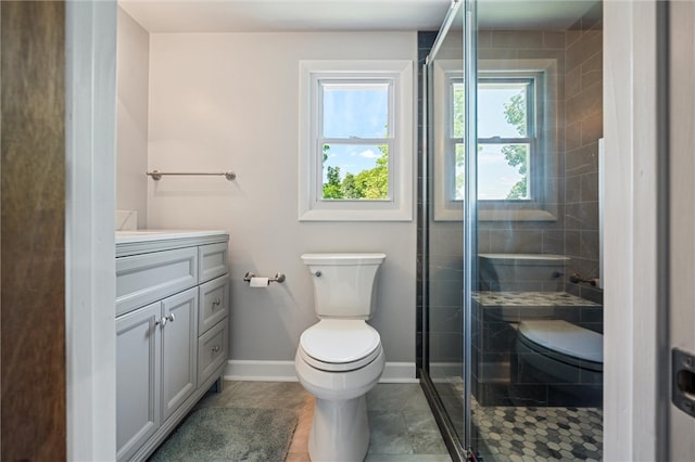 bathroom with tile flooring, an enclosed shower, vanity, and toilet