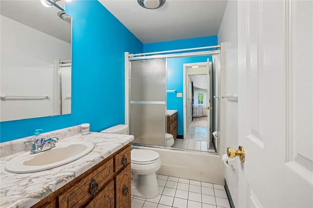 full bathroom featuring tile flooring, vanity, toilet, and enclosed tub / shower combo