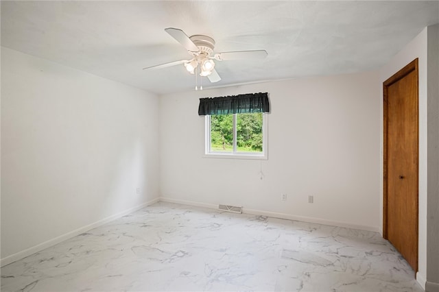 unfurnished bedroom with tile flooring and ceiling fan