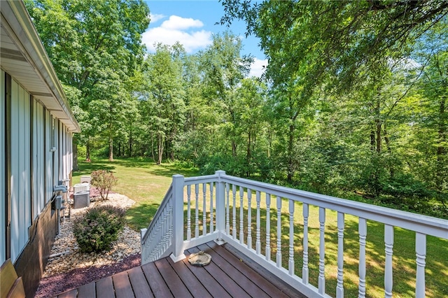 wooden terrace with a lawn