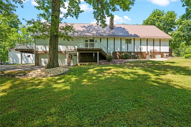 exterior space with a garage and a yard