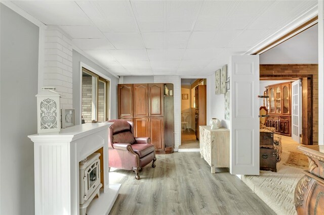 sitting room with light hardwood / wood-style flooring