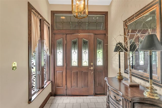 foyer entrance featuring plenty of natural light and light tile floors