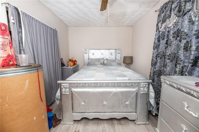 bedroom featuring ceiling fan and light hardwood / wood-style flooring