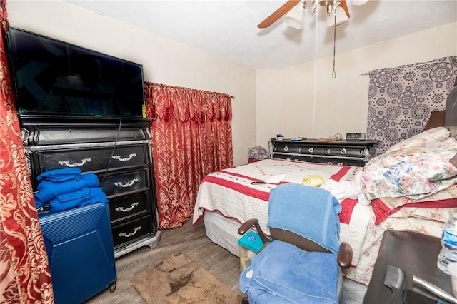 bedroom with ceiling fan and hardwood / wood-style floors