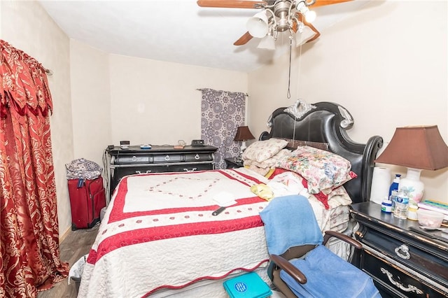 bedroom featuring ceiling fan and hardwood / wood-style floors