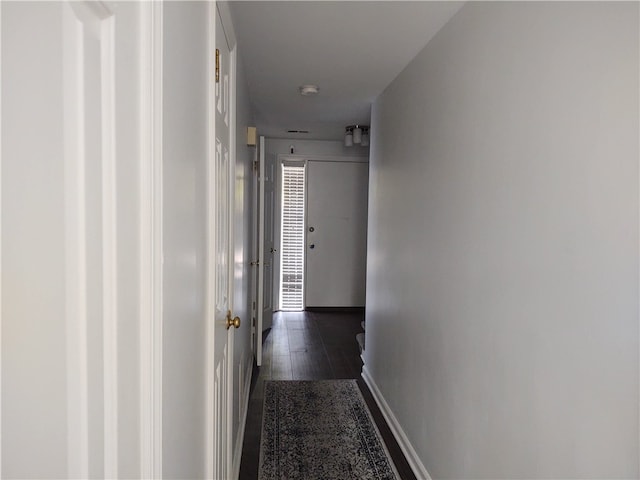 hallway featuring dark hardwood / wood-style flooring