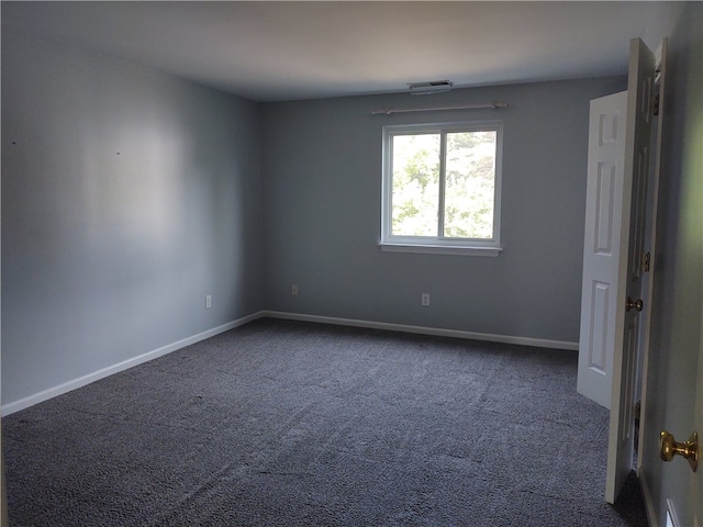 spare room featuring carpet