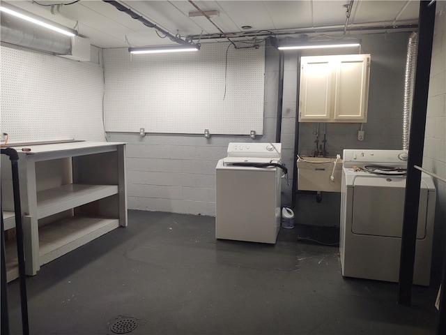 laundry area featuring independent washer and dryer and sink