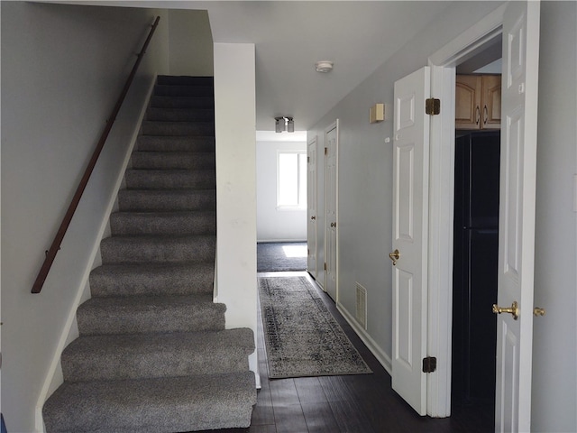 stairway featuring hardwood / wood-style floors