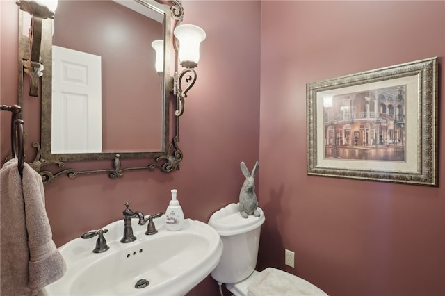 bathroom with sink and toilet