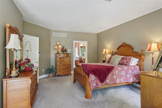 bedroom with light carpet