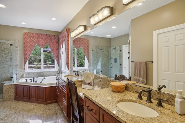 bathroom with shower with separate bathtub and vanity