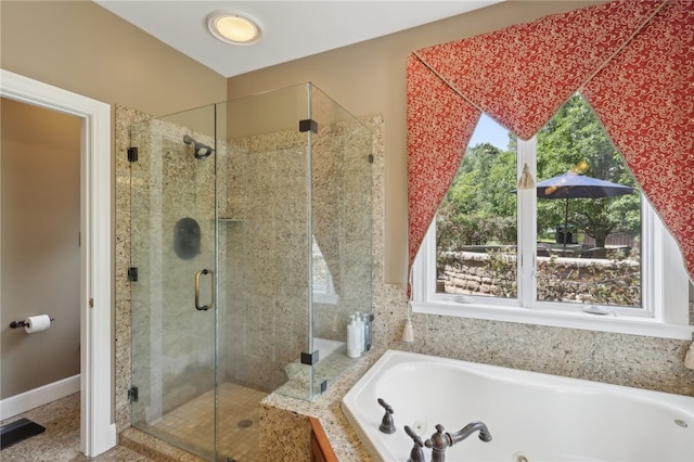 bathroom with a healthy amount of sunlight and plus walk in shower