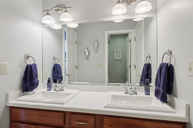 bathroom featuring oversized vanity and double sink