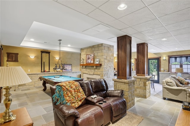 recreation room with a fireplace, light tile flooring, billiards, and a drop ceiling