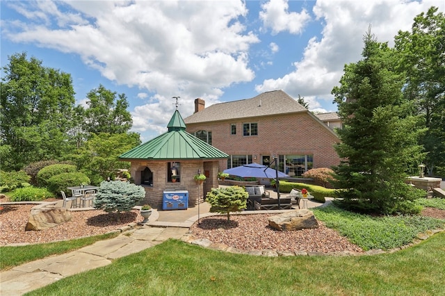 rear view of property with a patio