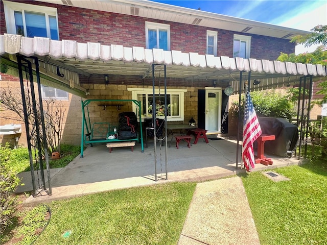 back of house featuring a yard