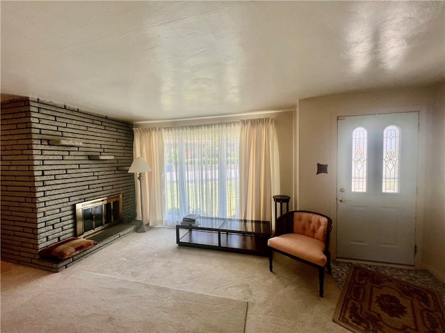 carpeted entryway featuring a fireplace