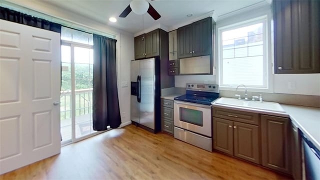 kitchen with light hardwood / wood-style floors, sink, a healthy amount of sunlight, and stainless steel appliances