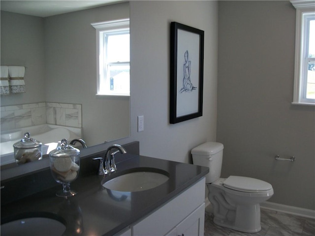 bathroom featuring vanity and toilet