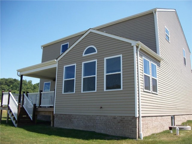 view of property exterior with a deck