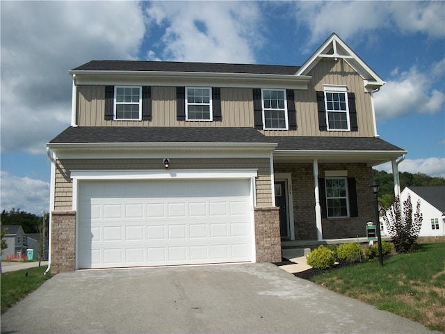 view of front of house featuring a front yard and a garage