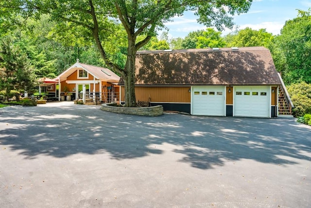 view of front of home with an outbuilding and a garage