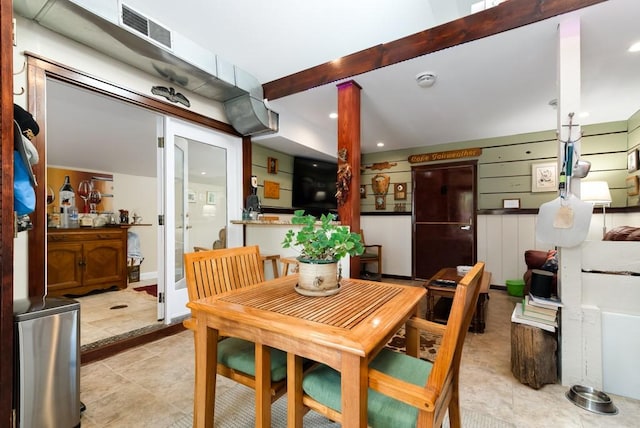 dining room with beam ceiling