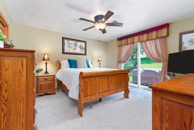 bedroom with light colored carpet, access to exterior, and ceiling fan