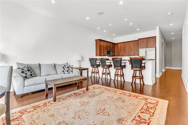 living room with light hardwood / wood-style flooring