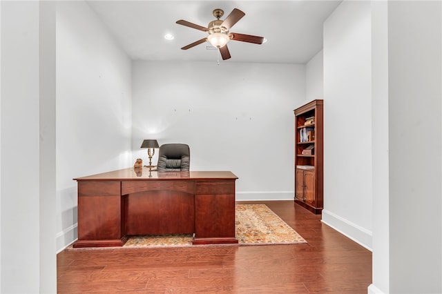 office area featuring ceiling fan and dark hardwood / wood-style floors