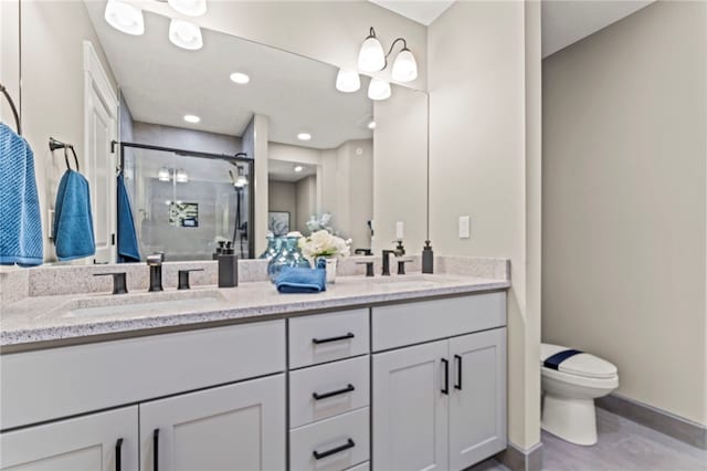 bathroom with double sink vanity and toilet