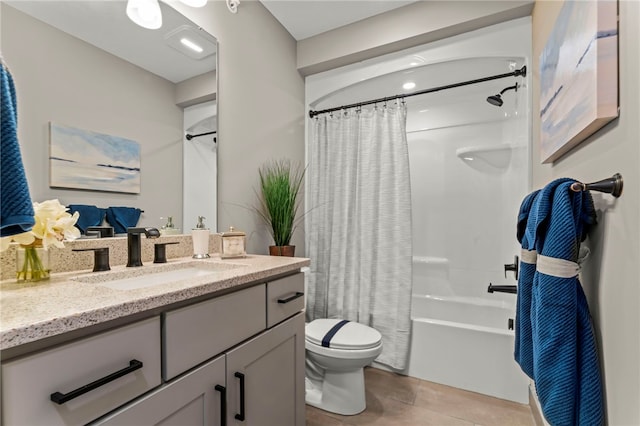 full bathroom featuring shower / bath combo with shower curtain, vanity, tile patterned flooring, and toilet