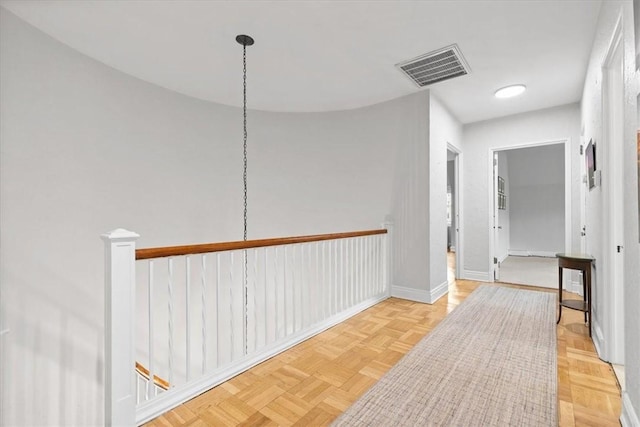 hallway featuring light parquet floors