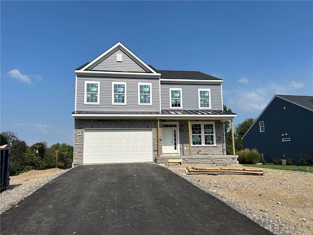 view of front of home featuring a garage and covered porch