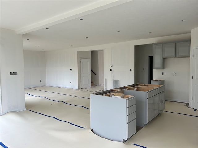 kitchen featuring a center island and gray cabinetry