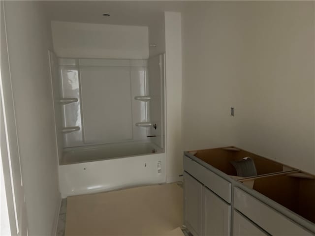 bathroom featuring bathtub / shower combination and vanity