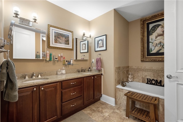 bathroom with a bathing tub, tile patterned flooring, and dual bowl vanity