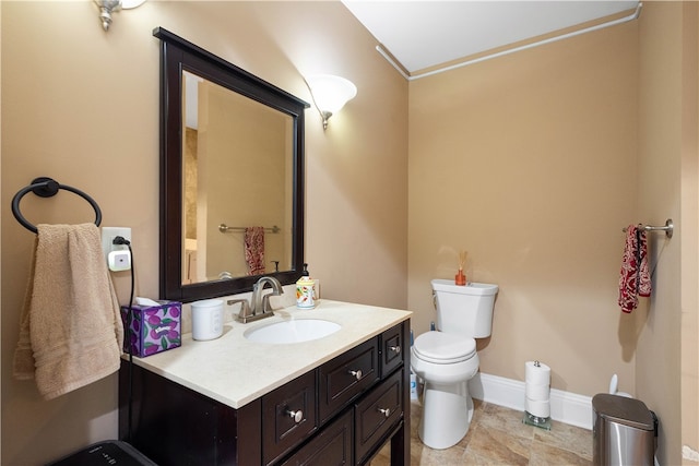 bathroom with tile patterned floors, vanity, and toilet