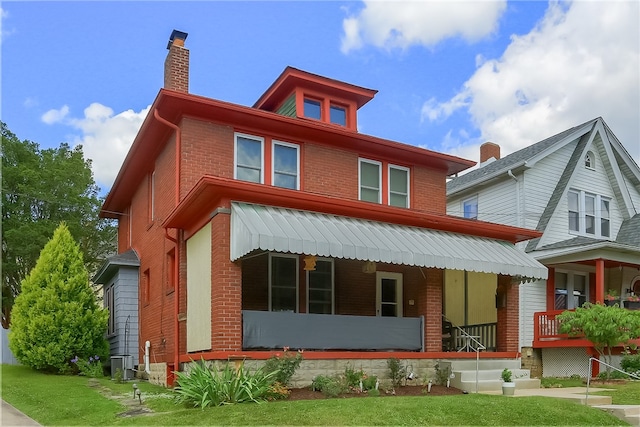 exterior space featuring a porch and a front yard