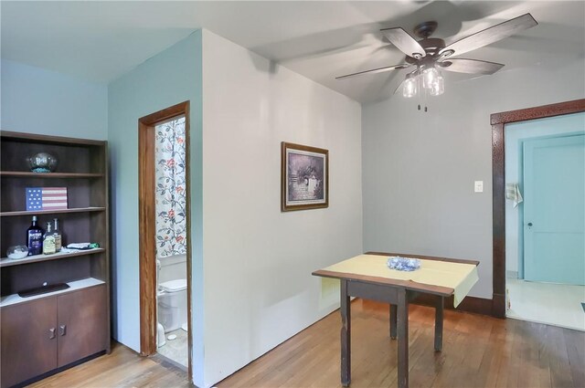 interior space with ceiling fan and wood-type flooring