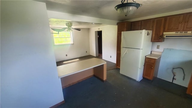 kitchen featuring white fridge and ceiling fan