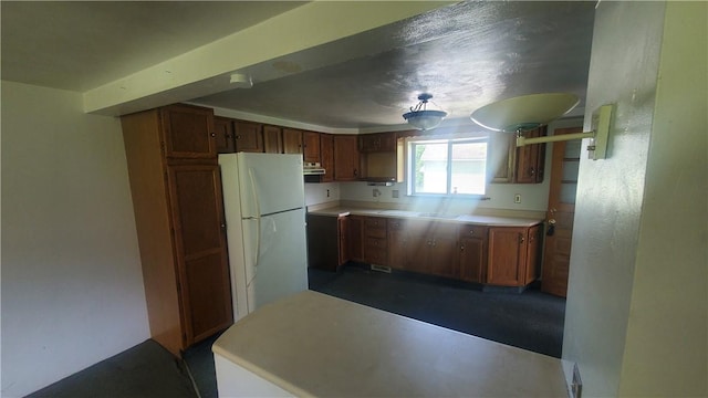 kitchen featuring white fridge